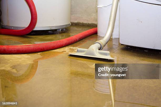 Water vacuuming in a flooded basement
